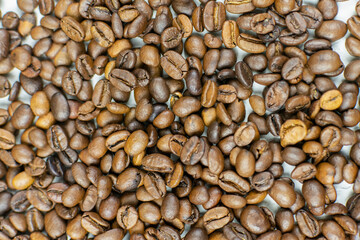 Background of roasted coffee beans close-up. Place for the text .