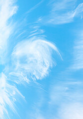 Obraz premium Blue sky and white clouds background - Scattered clouds cover a blue sky in the background