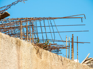 Rusty iron structure on a construction site, on a wall. Geometric shapes, abstract design.