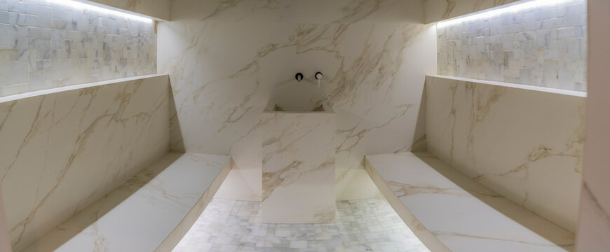 Classic Turkish Hammam. White Turkish Bath With Marble Surfaces. Marble Oriental Bathroom. Steam Bath Interior.