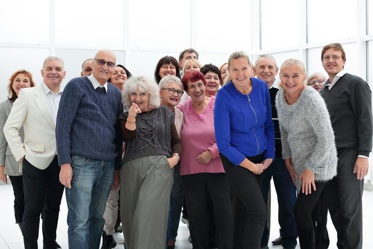 group of happy seniors look at camera