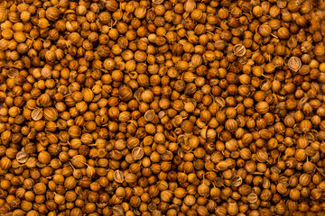 Coriander spice, closeup flat lay. Indian and Arabic peppers for cooking. Medicinal herbs and spices.