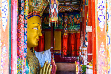 Fototapeta premium Beautiful and respectful golden buddha statue (Maitreya Buddha statue) in Thiksey monastery temple , Leh-Ladakh , India