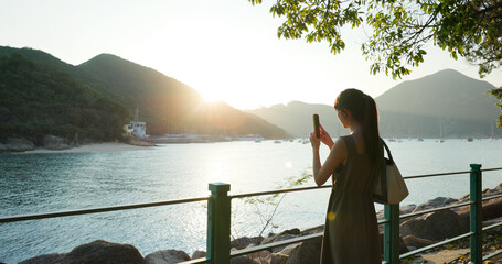Woman use cellphone to take photo