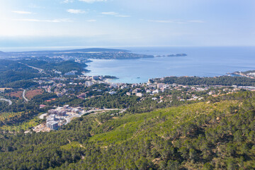 Fototapeta na wymiar Aerial view of Peguera from mountain side with hotels and beaches. Sea in background. Mallorca, Balearic Islands, Spain