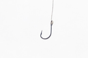 Fishing hook on a white background. fishing equipment on braided line