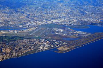 An aerial view of the San Jose International Airport, and the surrounding, sprawling town that has grown in California