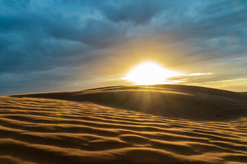 Dunes in the desert at sunset. Soft focus.