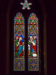 Fototapeta na wymiar St John the Evangelist Church in Otterburn, Northumberland, UK with stained glass windows.