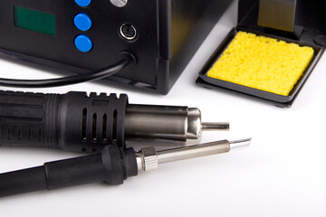 Soldering iron with a station on a white background