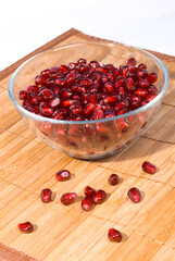 Plate with pomegranate seeds on rug