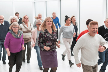 a group of pensioners are preparing to run forward