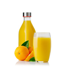 Glass of orange juice and orange juice bottles. Glass and bottle of organic tropical juice