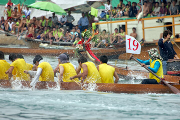 Dragon boat race in front of spectators