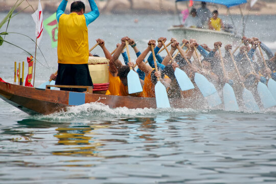 Dragon boat with crew and drummer