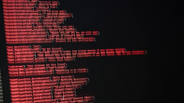 Programmer using laptop. Program code and script data on the screen close-up. Hacker attack. 