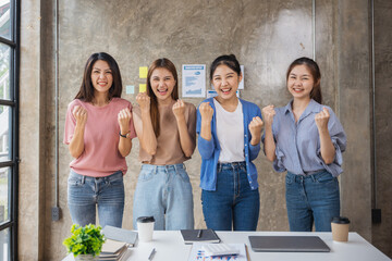 Happy excited successful asian women startup business team in office