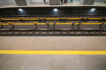 Railroad track in subway station with contact rail