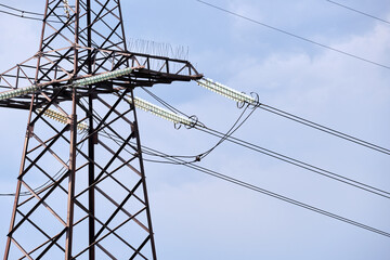 High voltage power line with insulation divider of electric power wires for safe delivering of electrical energy through steel cable on long distance