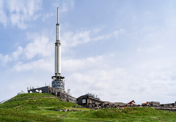 Fototapeta na wymiar TV tower built on top of the extinct Puy de Dome volcano. Auvergne Volcanoes Regional Park.