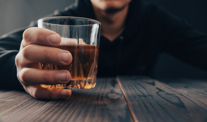 men holding a glass of whiskey