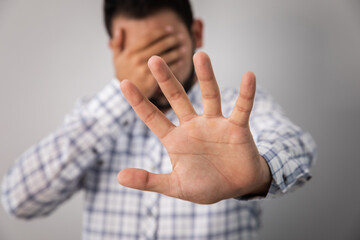 sad man hand stop sign