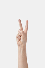 Counting on fingers female hand, two or V letter on white.