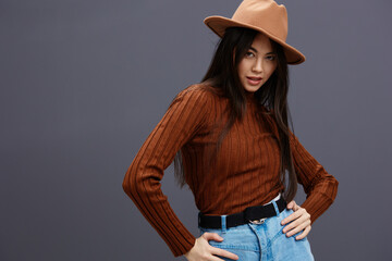 woman in Hat fun brown sweater posing casual wear isolated background