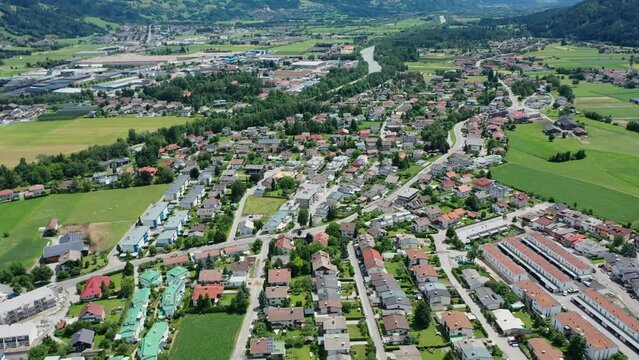 Beautiful mountain view in the city of Lienz, Austria. Alpine mountains, clouds and sunlight over the city. Aerial view over the Austrian city in the mountains Alps	
