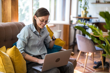 Young woman using a laptop at home
