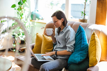 Young woman using a laptop at home
