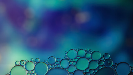 Fantasy colorful blurry background with ornament made of soft clear bubbles, abstract color splashes with copy space, focus on foreground