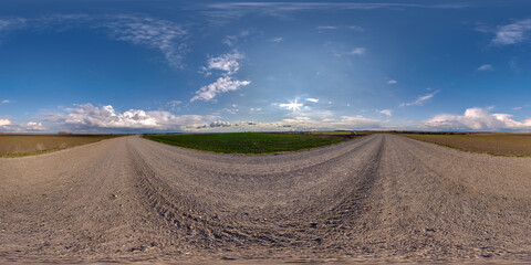 Fototapeta na wymiar full seamless spherical hdri 360 panorama view on no traffic gravel road among fields in autumn evening in equirectangular projection, ready for VR AR