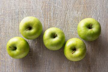 Green apples on the table, close up
