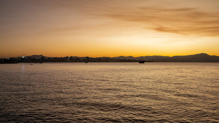 Sunset view in Florianopolis in southern Brazil. Boardwalk by the sea. Panorama. Nature. Cityscape. Golden hour.