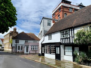 Church street view in Chiswick, West London, England. Street of medieval area near St. Nicholas church, old town, near Thames Riverside, mix of old and modern architecture. Half-timbered cottage