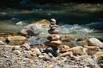 cairn near a mountain stream in filisur in early summer. Fresh flowing water. Landwasser. High quality photo