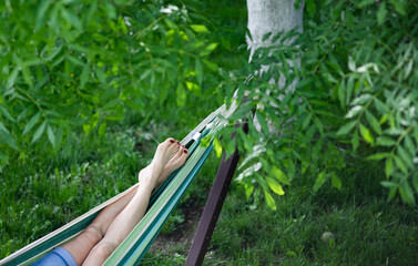 top view of woman relaxing in hammock