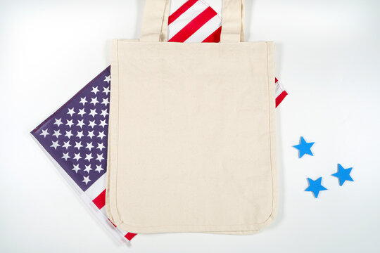 Canvas cottom carry tote bag product mockup. Patriotic Fourth of July, Independence Day theme craft product mockup styled with USA Stars and Stripes flag against a white background.