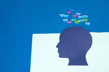 blue paper head on pastel paper and blue background, overhead futuristic 3d ball, creative idea creation, creative brain