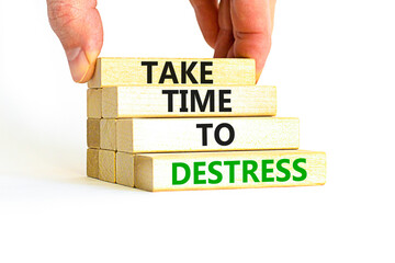 Take time to destress symbol. Concept words Take time to destress on wooden blocks. Beautiful white table white background. Psychological business and take time to destress concept. Copy space.