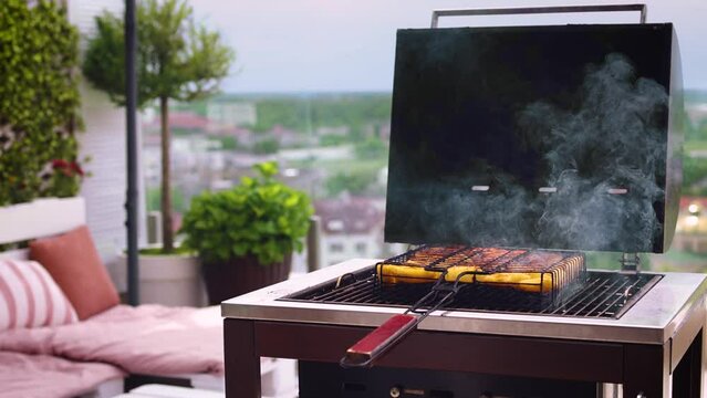 meat and vegetables are grilling on the bbq at summer patio garden