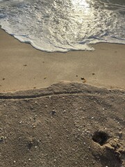 sand dropoff, tide foam