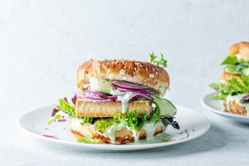 Tofu burger with vegetables on plate