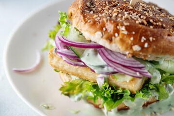 Tofu burger with vegetables on plate