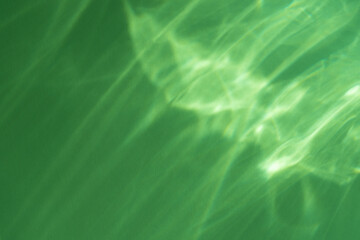 Caustic effect light refraction on green wall overlay photo mockup, blurred sun rays refracting...