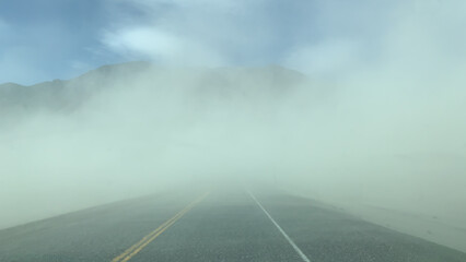 Dust storm over the highway from a dry glacier bed