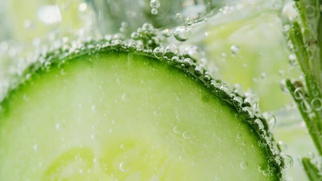 Lemonade with Cucumber and rosemary texture. Gin tonic cocktail close-up macro, healthy drink. Detox drinking, summer refreshment concept.