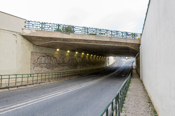 Fototapeta premium Under passage tunnel in Olhao city with artwork