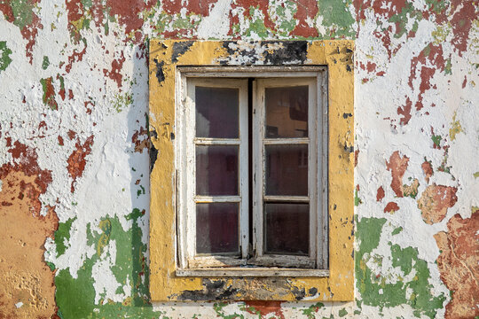 worn wheathered peeled painted wall with window